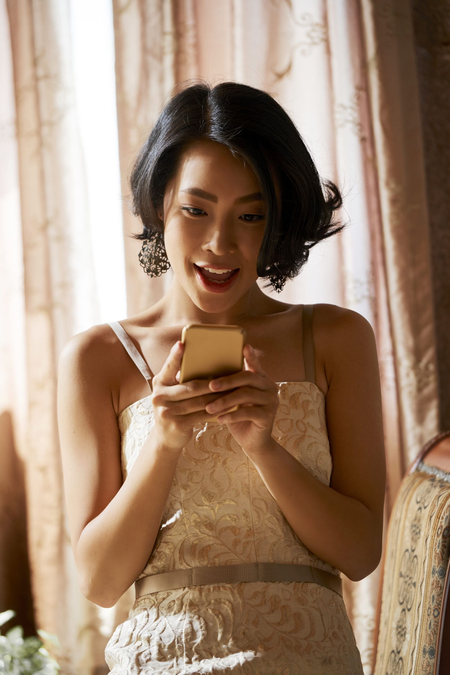 Portrait of excited woman reading promo on her smartphone